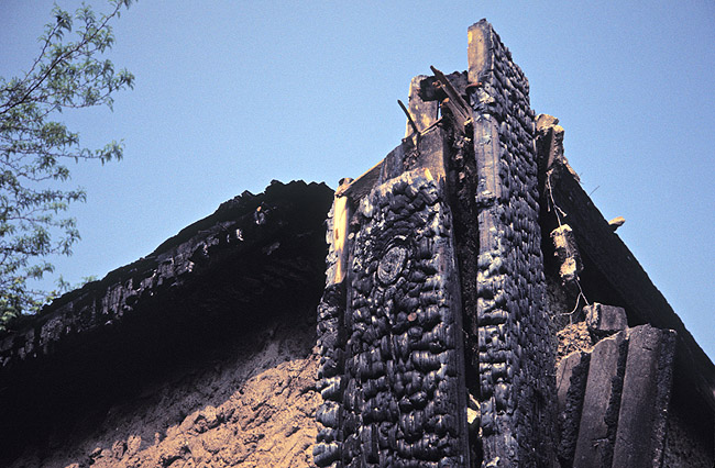 [ CLOSE-UP OF ARSON DAMAGE ]